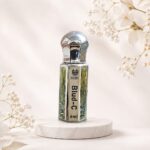 Blud-C premium perfume oil 6ml in luxury silver bottle with elegant floral background.