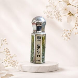 Blud-C premium perfume oil 6ml in luxury silver bottle with elegant floral background.