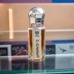 C Cristian premium perfume oil 6ml in elegant crystal style bottle with luxury background.
